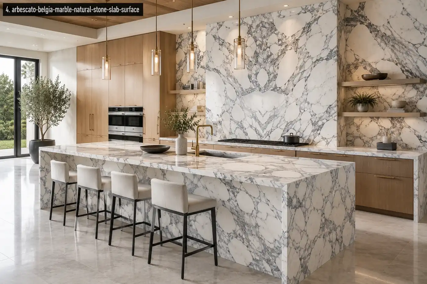 High contrast white marble kitchen with a waterfall island, full-height backsplash, silver-grey veins and oak cabinetry.