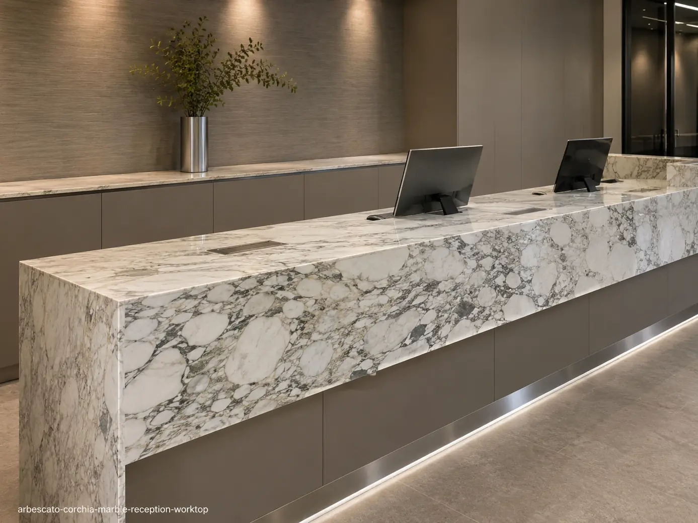 Arbescato Corchia Marble reception worktop with ivory stone, blue-grey veining and rounded brecciated patterns.