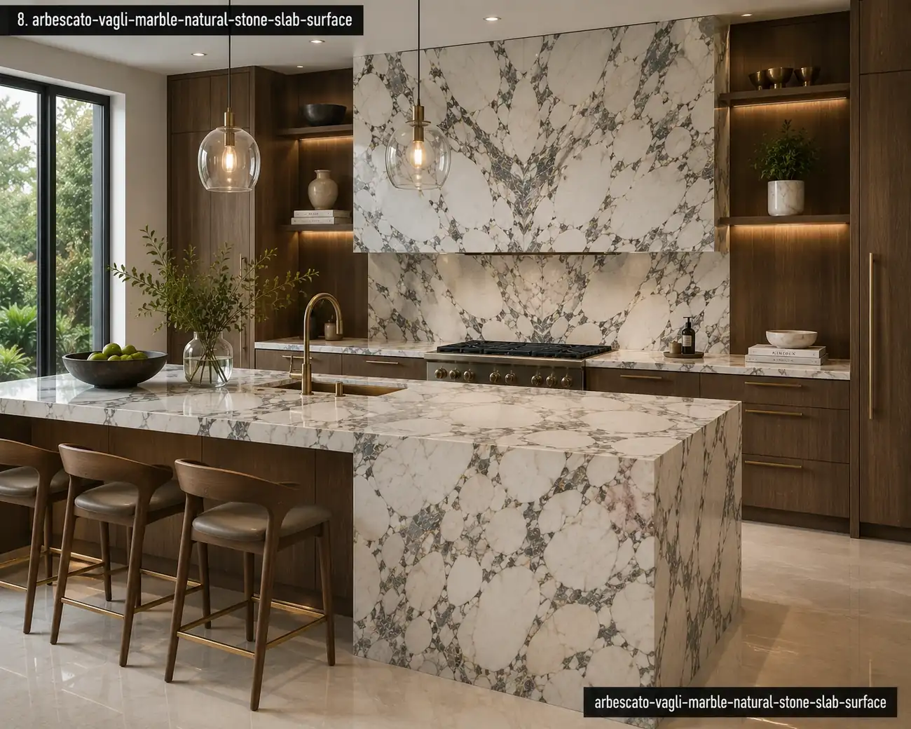 Warm gold accent marble kitchen with a waterfall island, bookmatched backsplash, bold grey veins and rich walnut cabinetry.