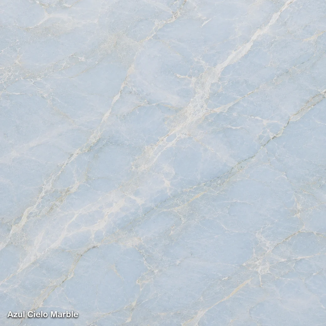 Azul Cielo Marble featuring pale sky blue stone, airy white clouding, faint green-grey wisps and a polished pearly finish.