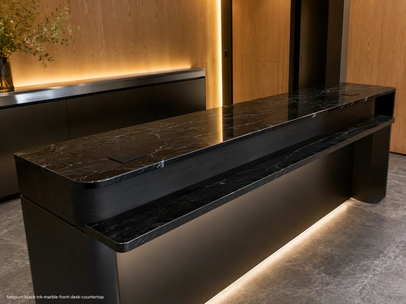 Belgium Black TRK Marble front desk countertop with polished black stone and fine grey veining in a modern reception.