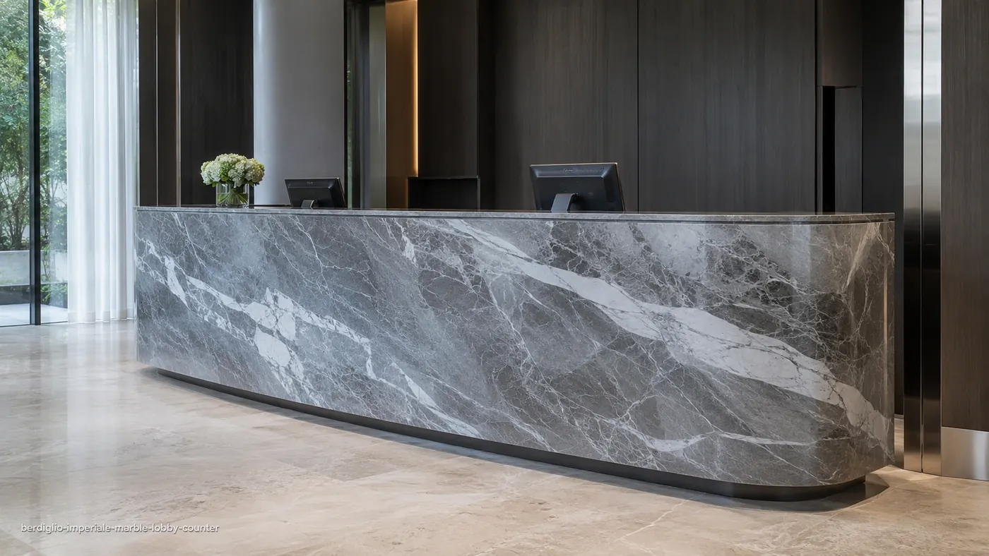 Berdiglio Imperiale Marble lobby counter with blue-grey stone, flowing white veins and a curved polished front.
