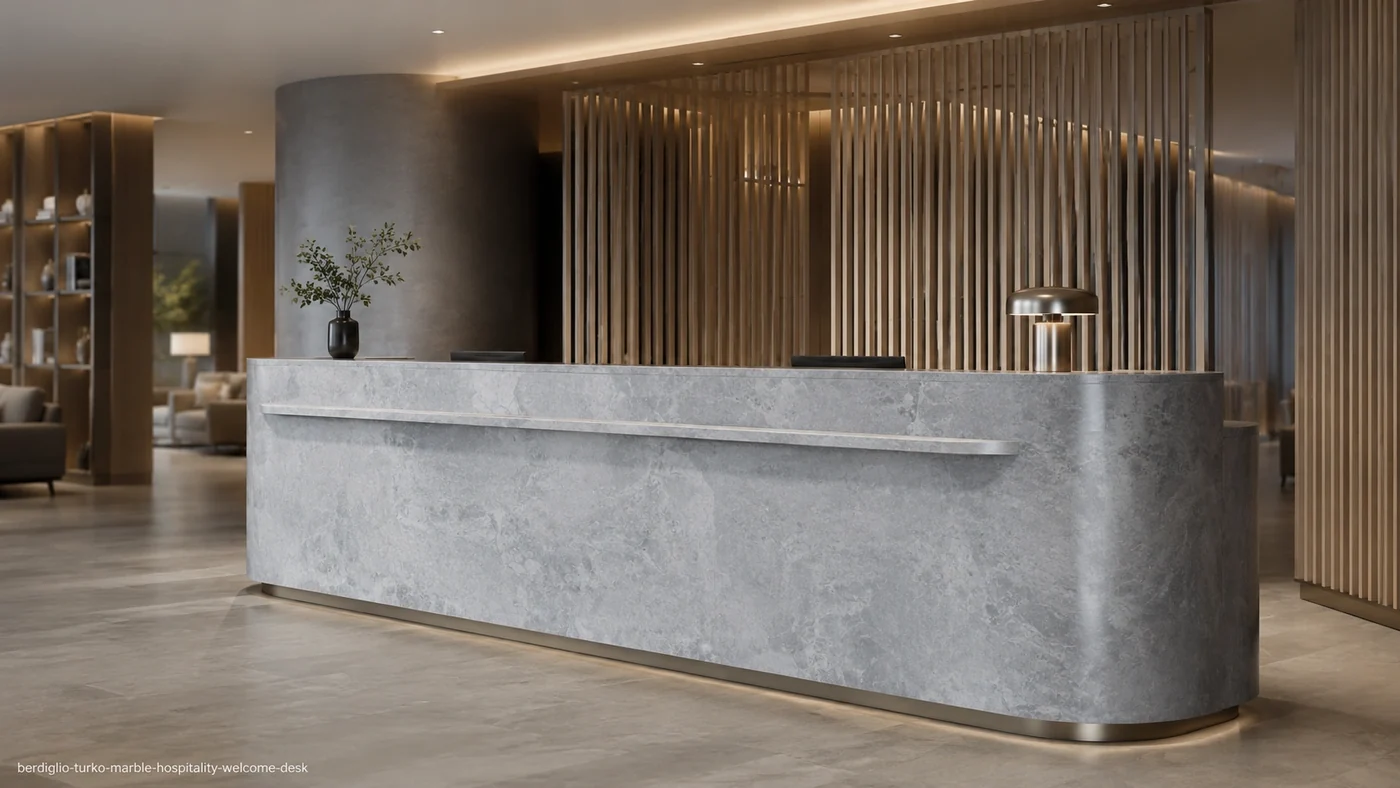 Berdiglio Turko Marble hospitality welcome desk with soft silver-grey clouds and a honed curved stone front.