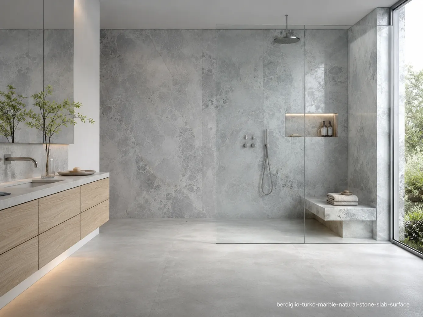 Cool charcoal veined surface in a minimalist spa bathroom with wall cladding, floating vanity, shower bench and honed floor.