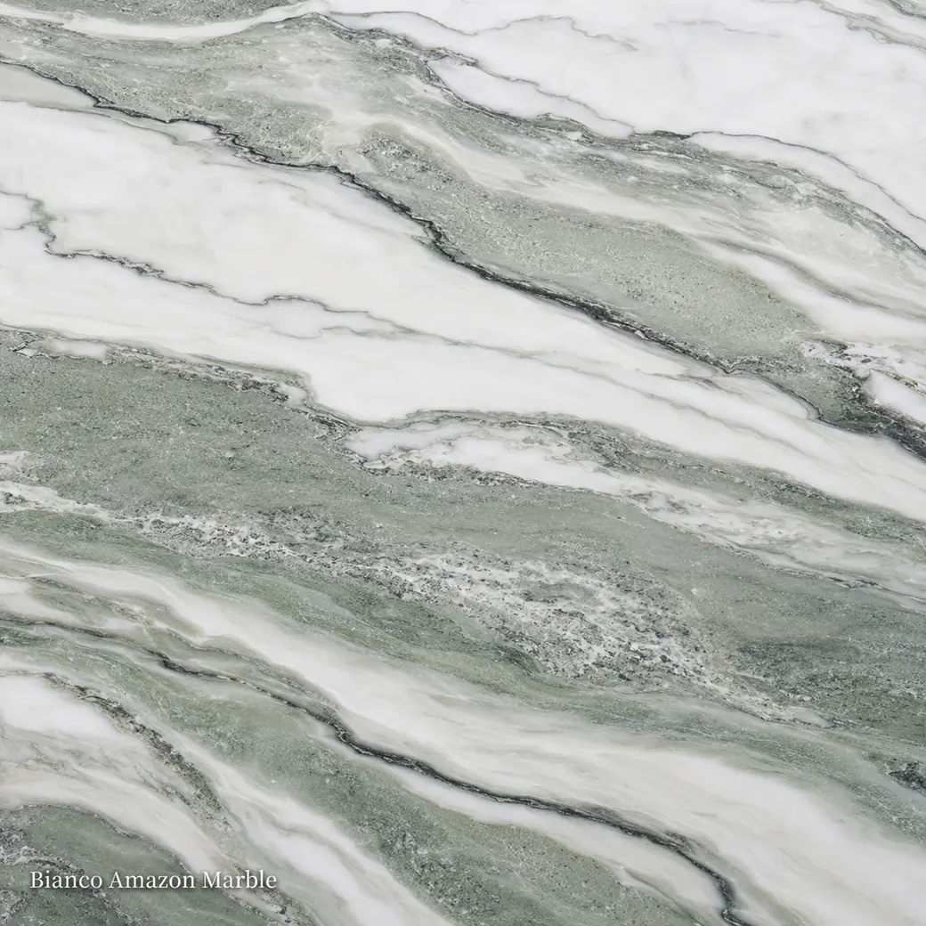 Bianco Amazon Marble with crisp white veined stone, sage-green flowing layers, charcoal seams and polished crystalline depth.