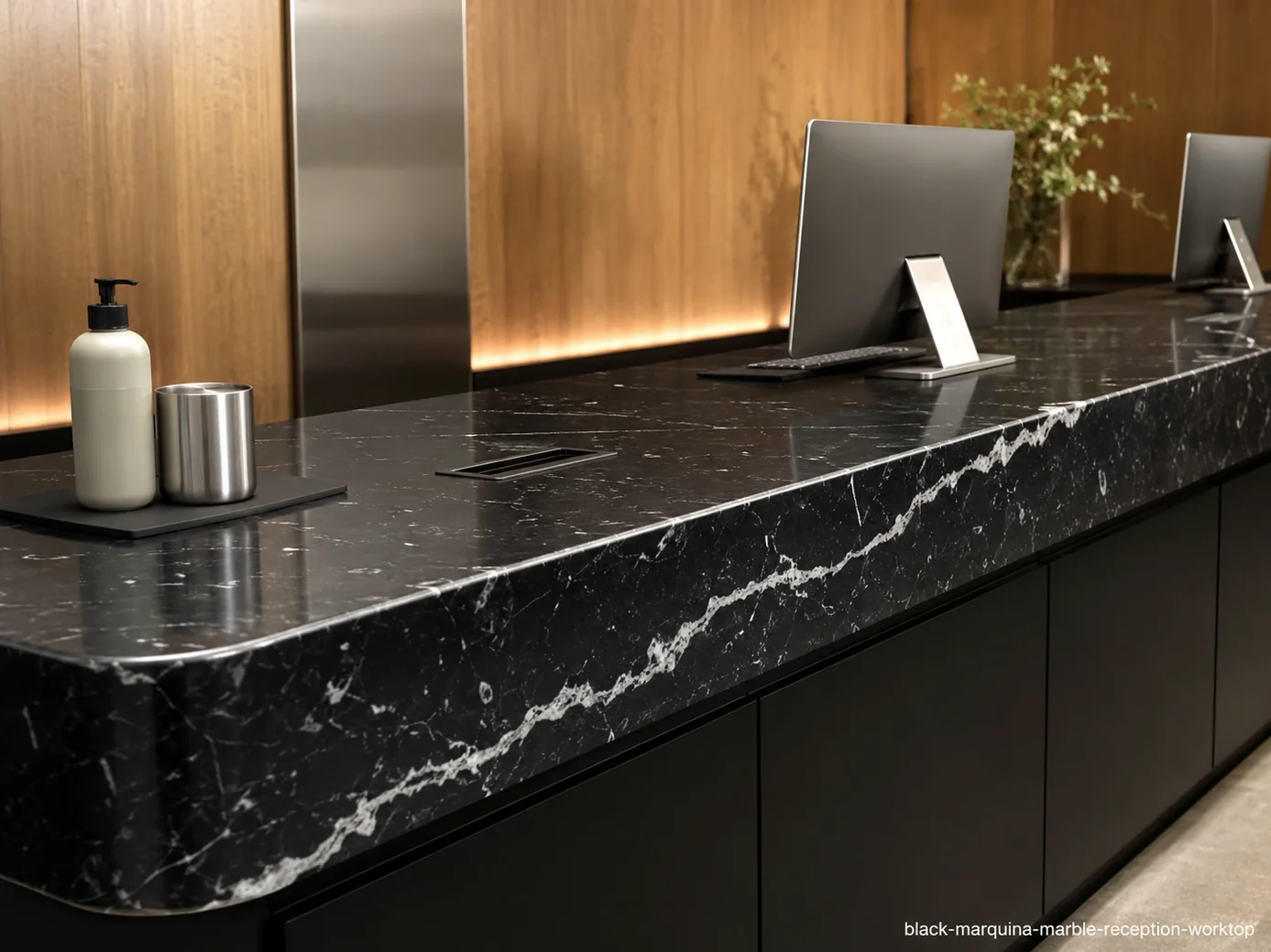 Black Marquina Marble reception worktop with midnight-black stone and sharp milky-white calcite veins.