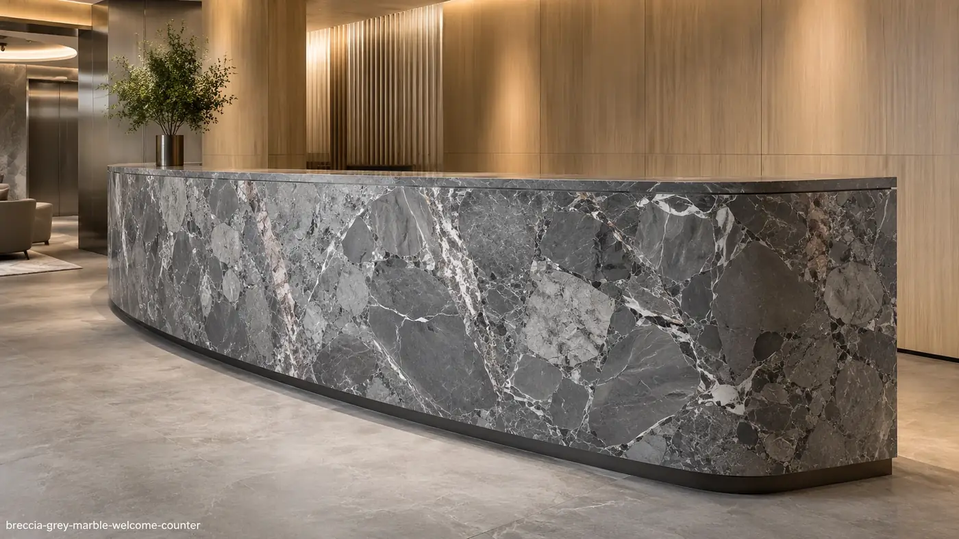 Breccia Grey Marble welcome counter with grey mosaic fragments, white outlines and subtle dusty-pink accents.