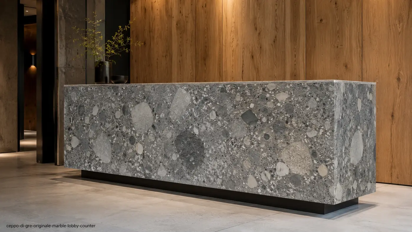 Ceppo di Gre Originale Marble lobby counter with blue-grey pebble aggregate and a honed architectural finish.