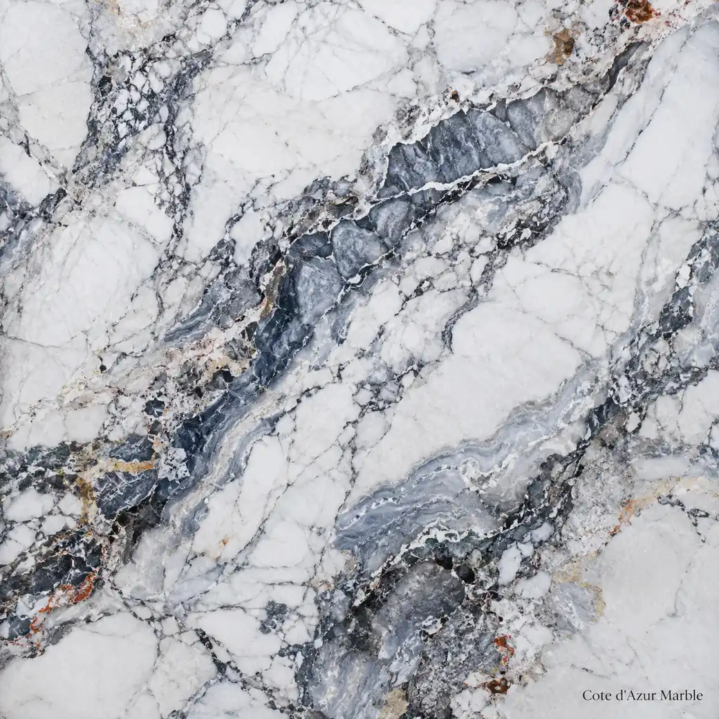 Cote d'Azur Marble with Riviera inspired grey stone, blue-grey ribbons, charcoal veins and subtle restrained warm accents.
