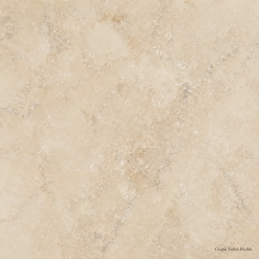Crema Nobel Marble with refined pale cream stone, subtle beige clouds, soft grey threads and a subtle warm polished glow.