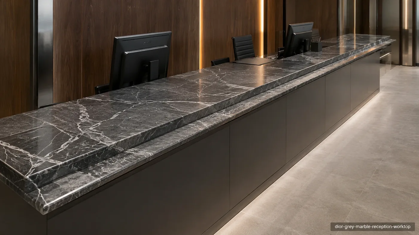 Dior Grey Marble reception worktop with smoky-grey stone, crisp white veins and polished edge details.