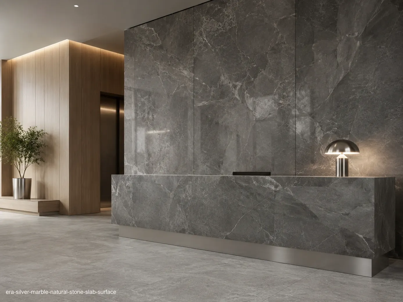 Polished contemporary surface across corporate lobby wall cladding, reception counter and flooring with silver-grey depth.