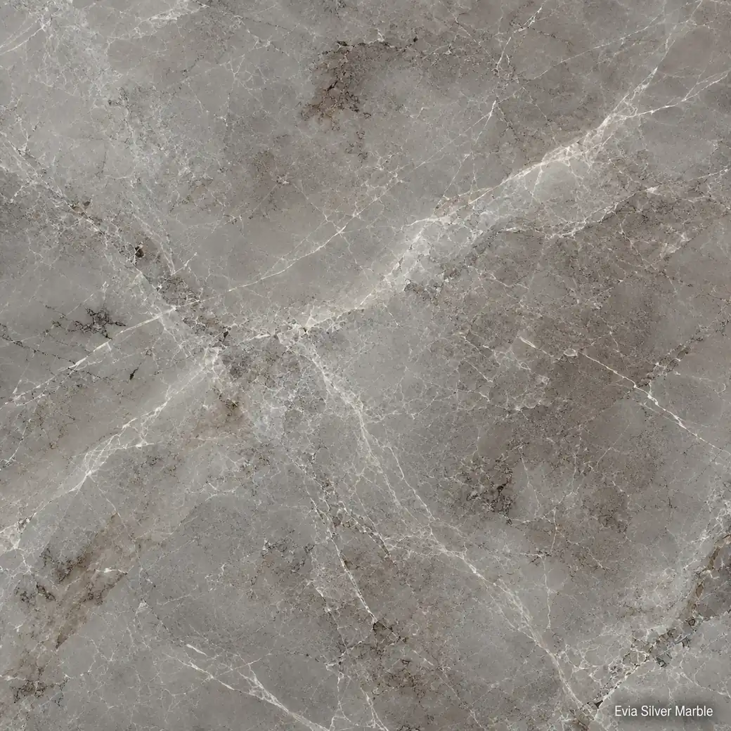 Evia Silver Marble with Greek silver grey stone, ivory veining, taupe-brown clouds and a refined polished mineral finish.
