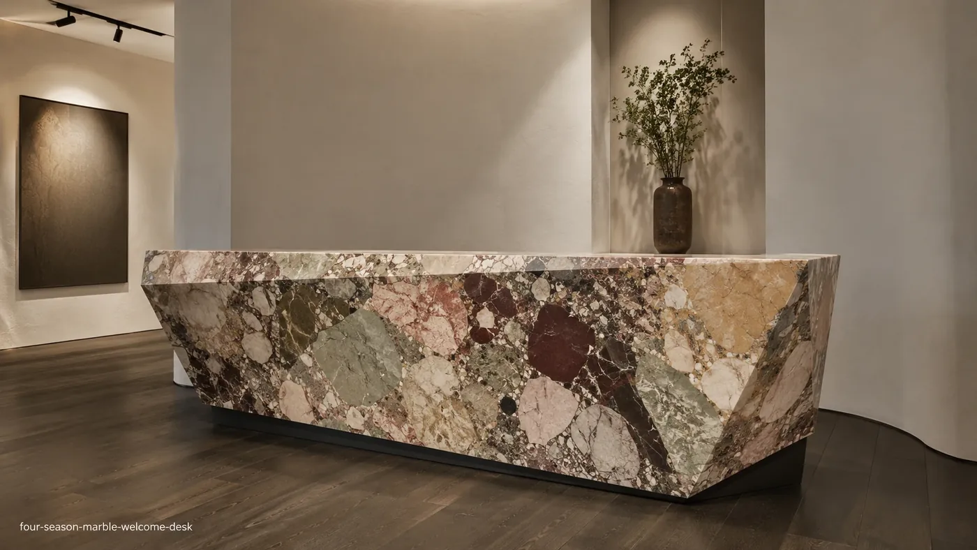 Four Season Marble welcome desk with sage, burgundy, ochre, blush and cream brecciated stone.