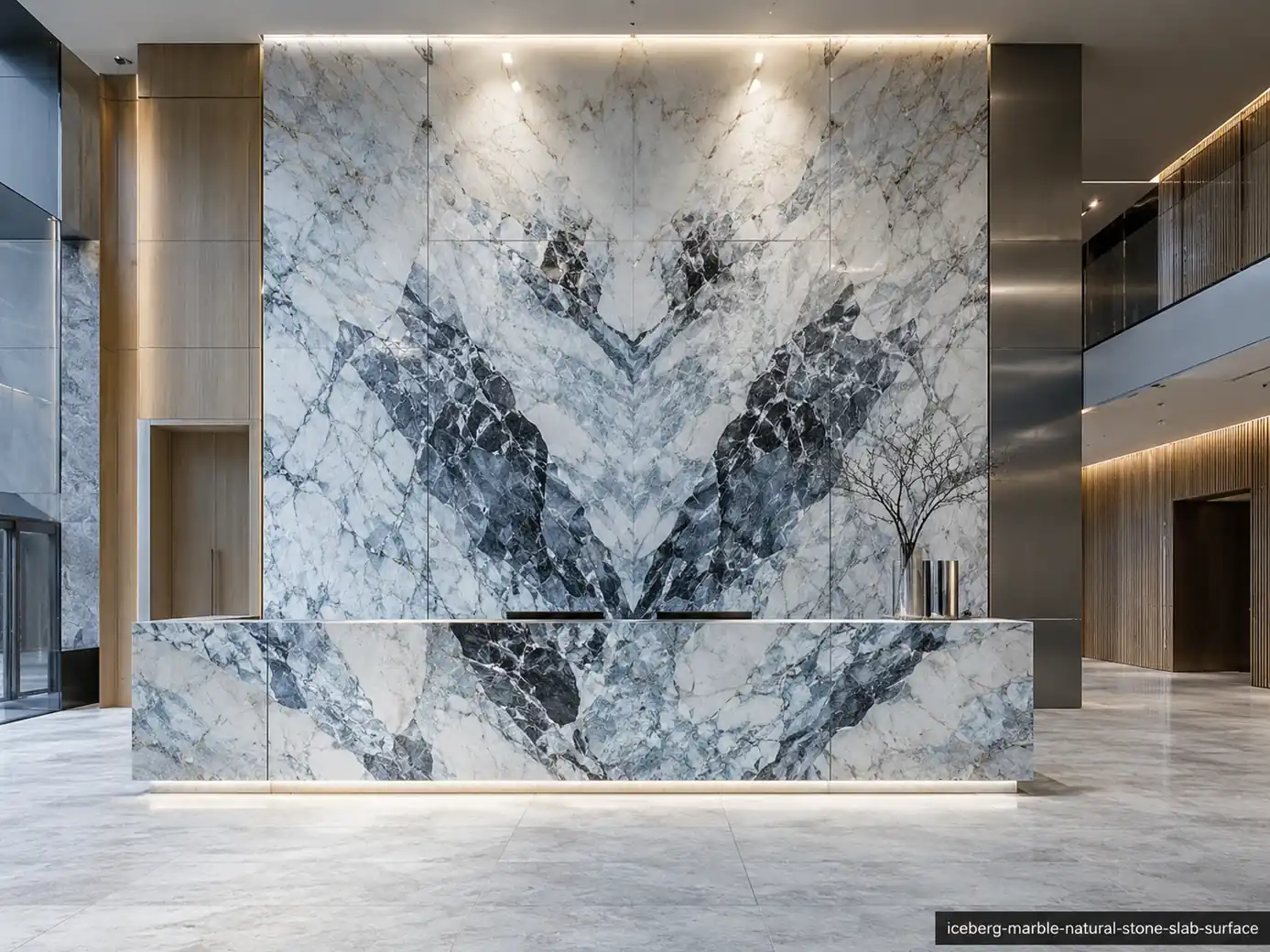 Frozen landscape inspired slab on a lobby wall, reception desk and floor panels with icy white, charcoal and blue movement.