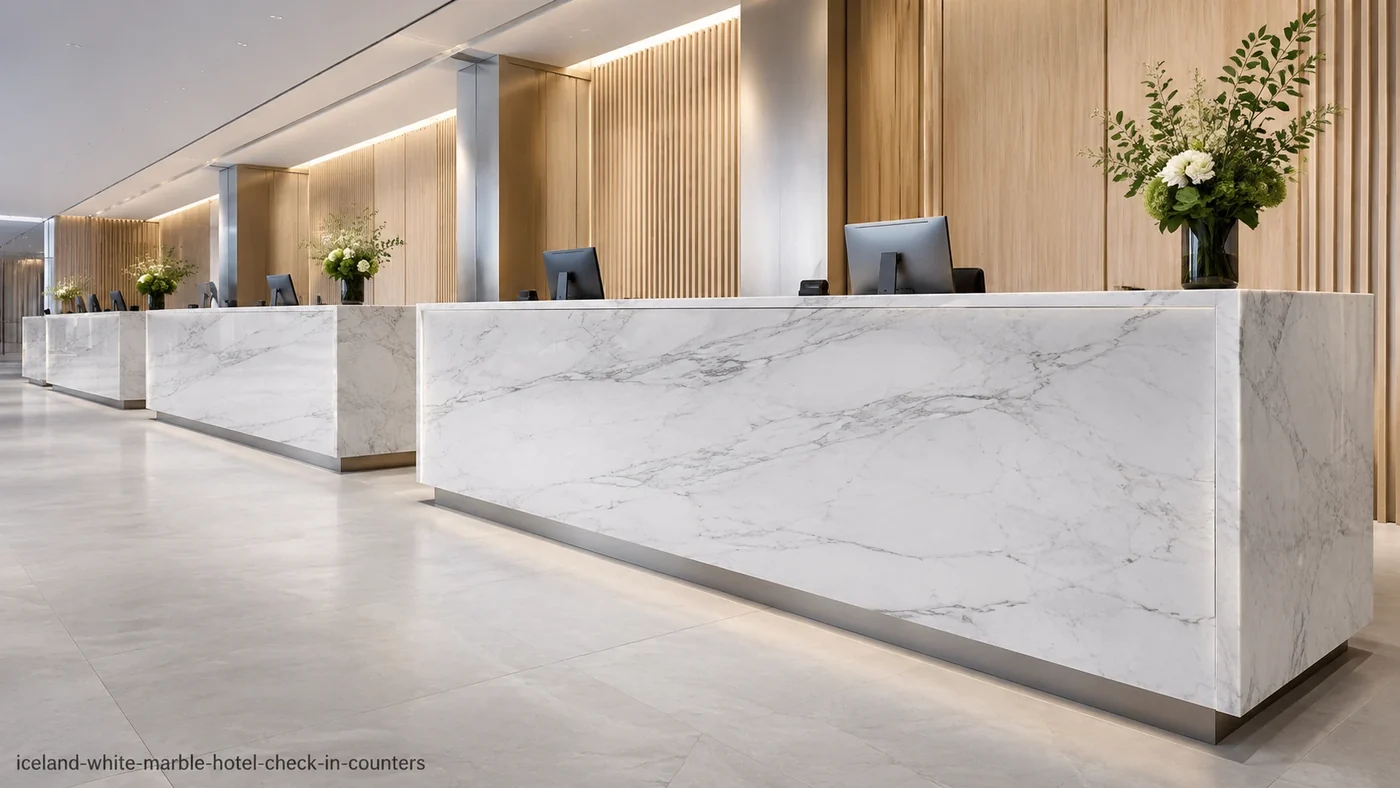 Iceland White Marble hotel check-in counters with frosted white stone and restrained silver-grey veins.