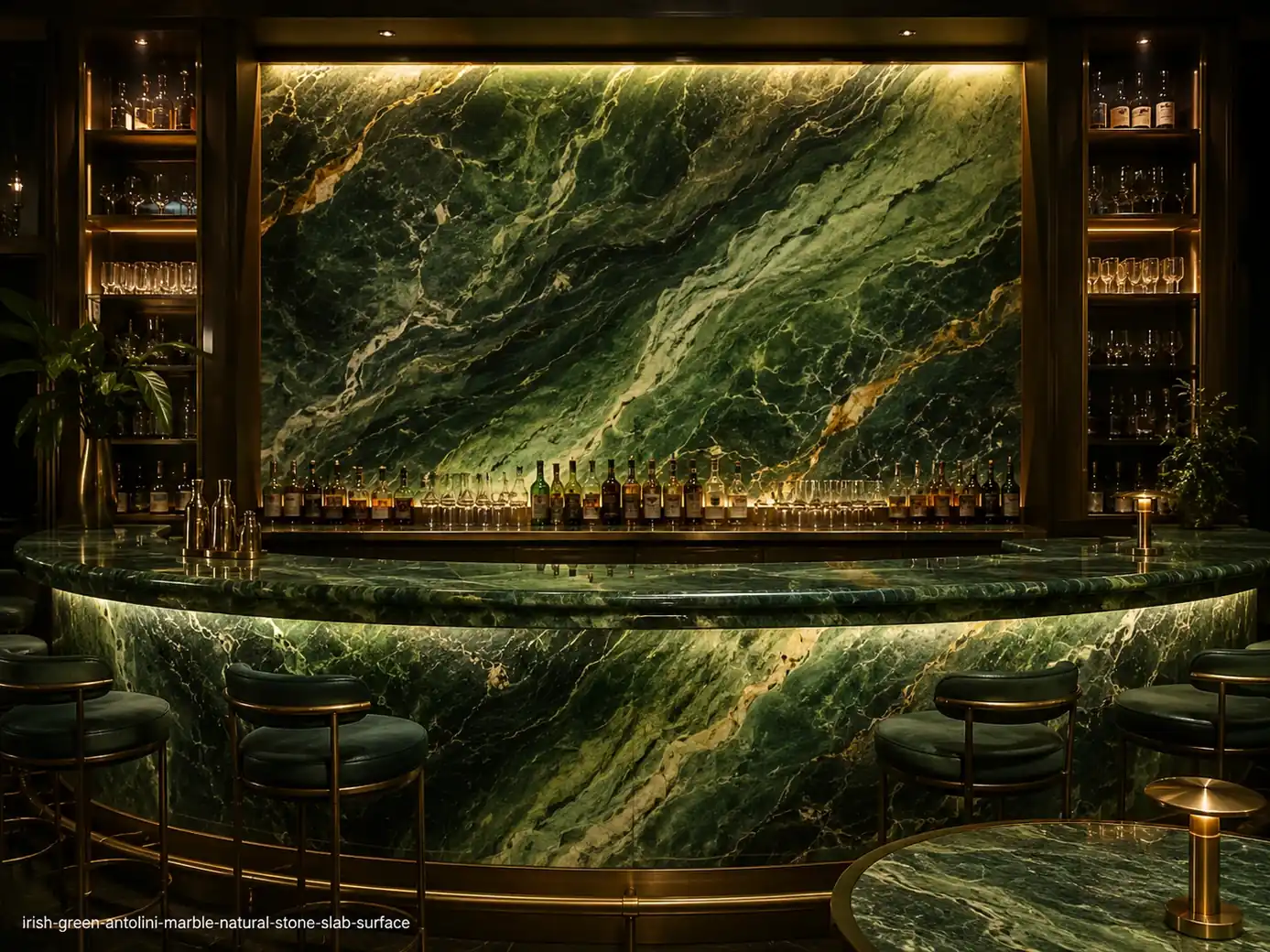 Jewel toned architectural slab on a backlit bar wall, counter and tabletops with emerald, jade and apple-green movement.