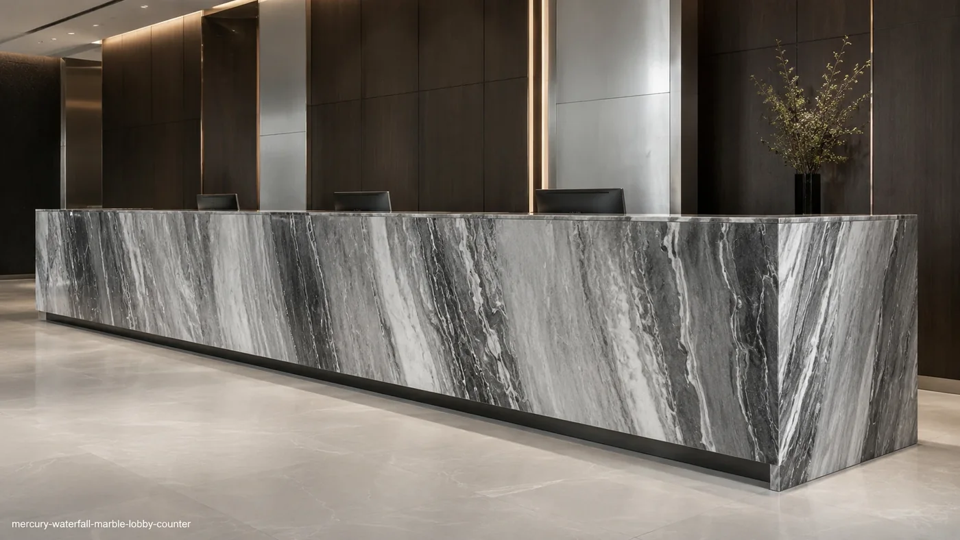 Mercury Waterfall Marble lobby counter with silver-grey stone and cascading charcoal and white ribbons.