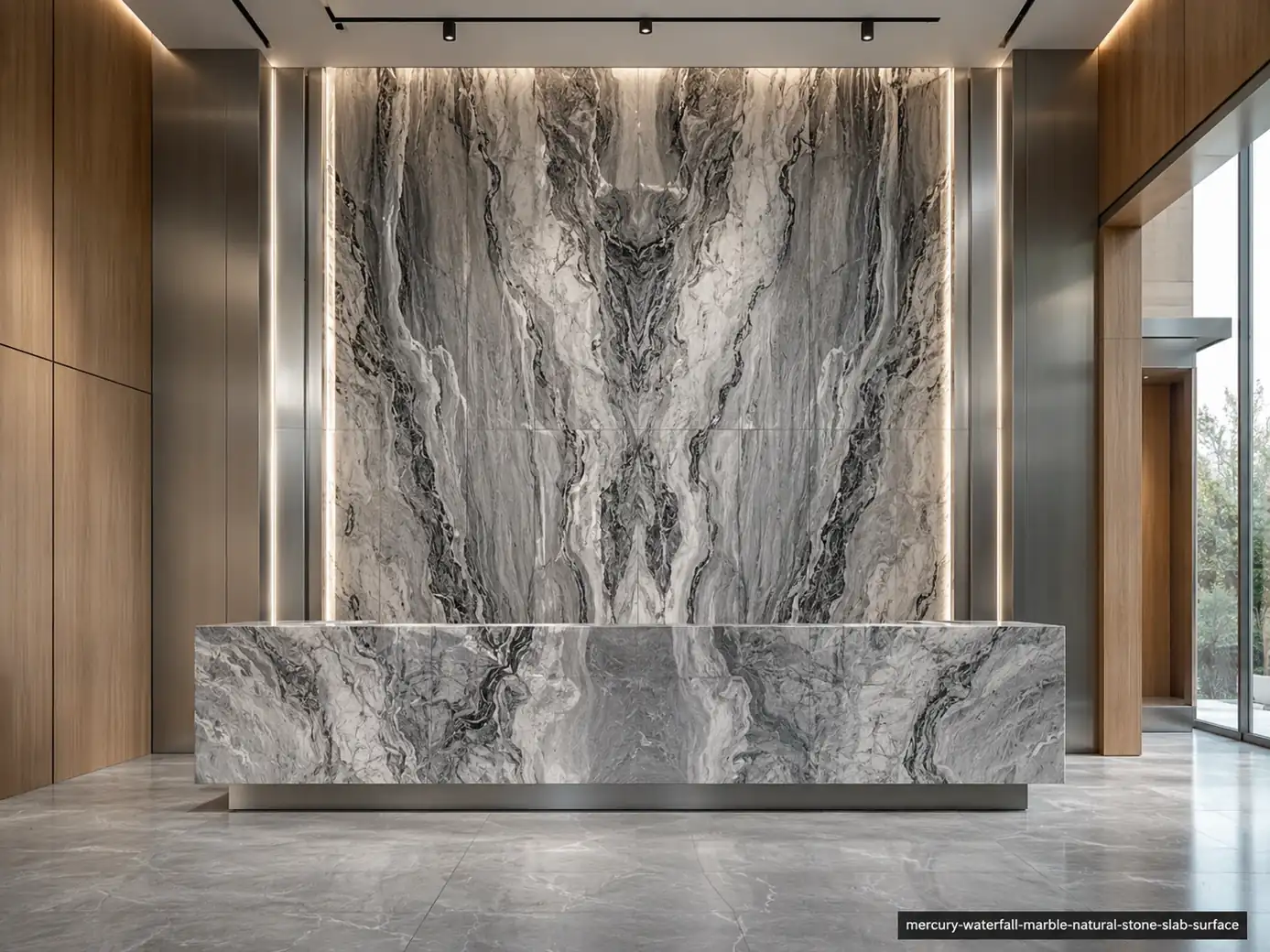 Dramatic waterfall inspired slab on a lobby wall and reception desk with silver, smoky white and graphite mineral currents.