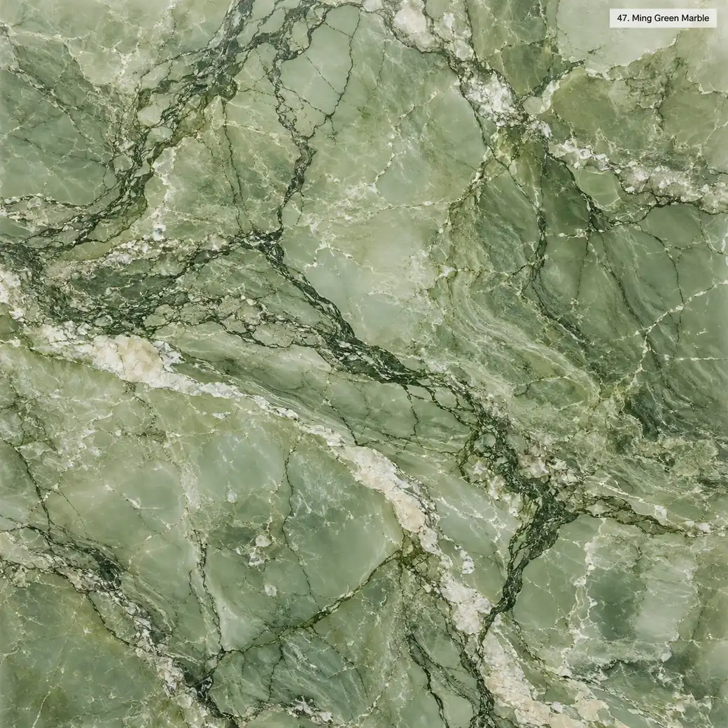 Ming Green Marble with soft jade green stone, dark branching veins, ivory patches and a luminous jewel-like polished finish.