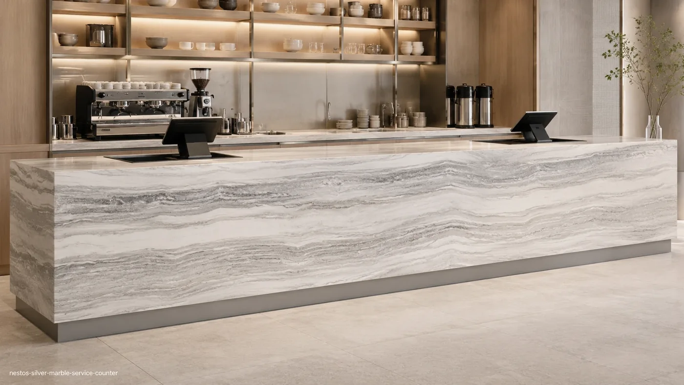 Nestos Silver Marble service counter with pale silver stone and calm parallel grey bands across the fascia.
