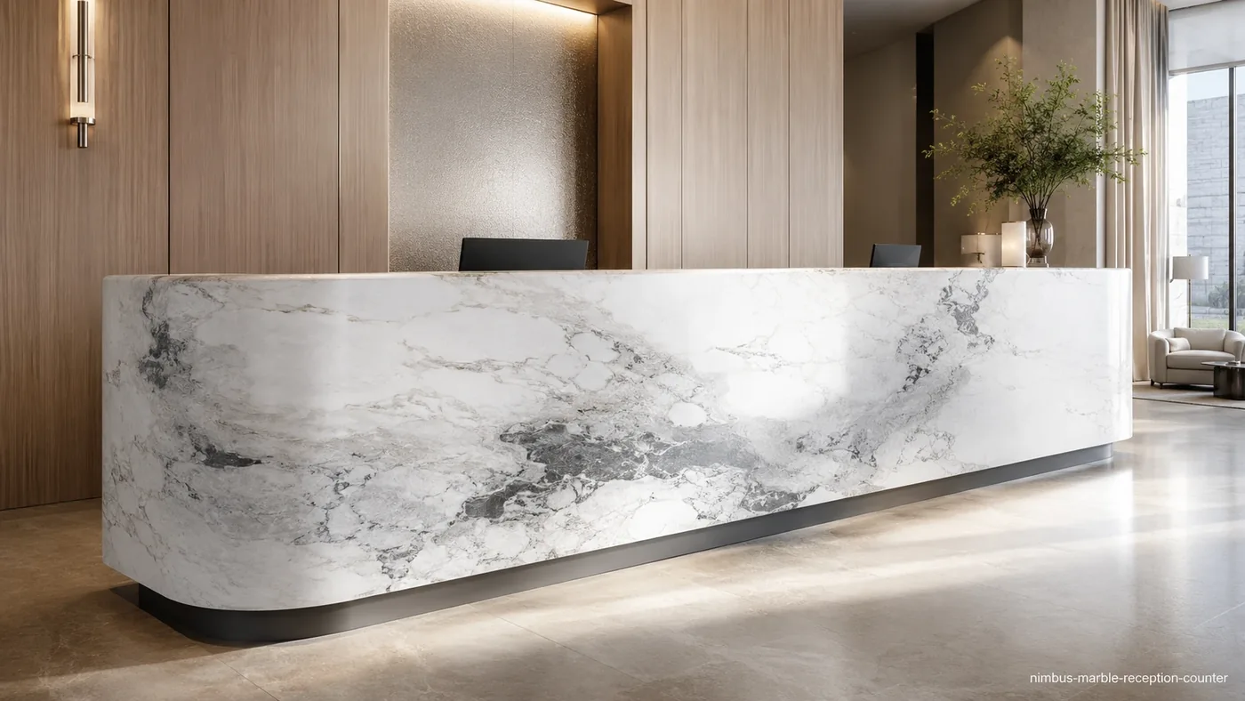 Nimbus Marble reception counter with luminous white stone, soft dove-grey clouds and silver swirling veins.