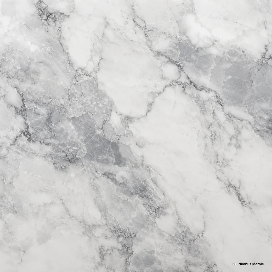 Nimbus Marble with cloud white dolomitic stone, dove-grey mist, curling veins and a luminous polished crystalline finish.