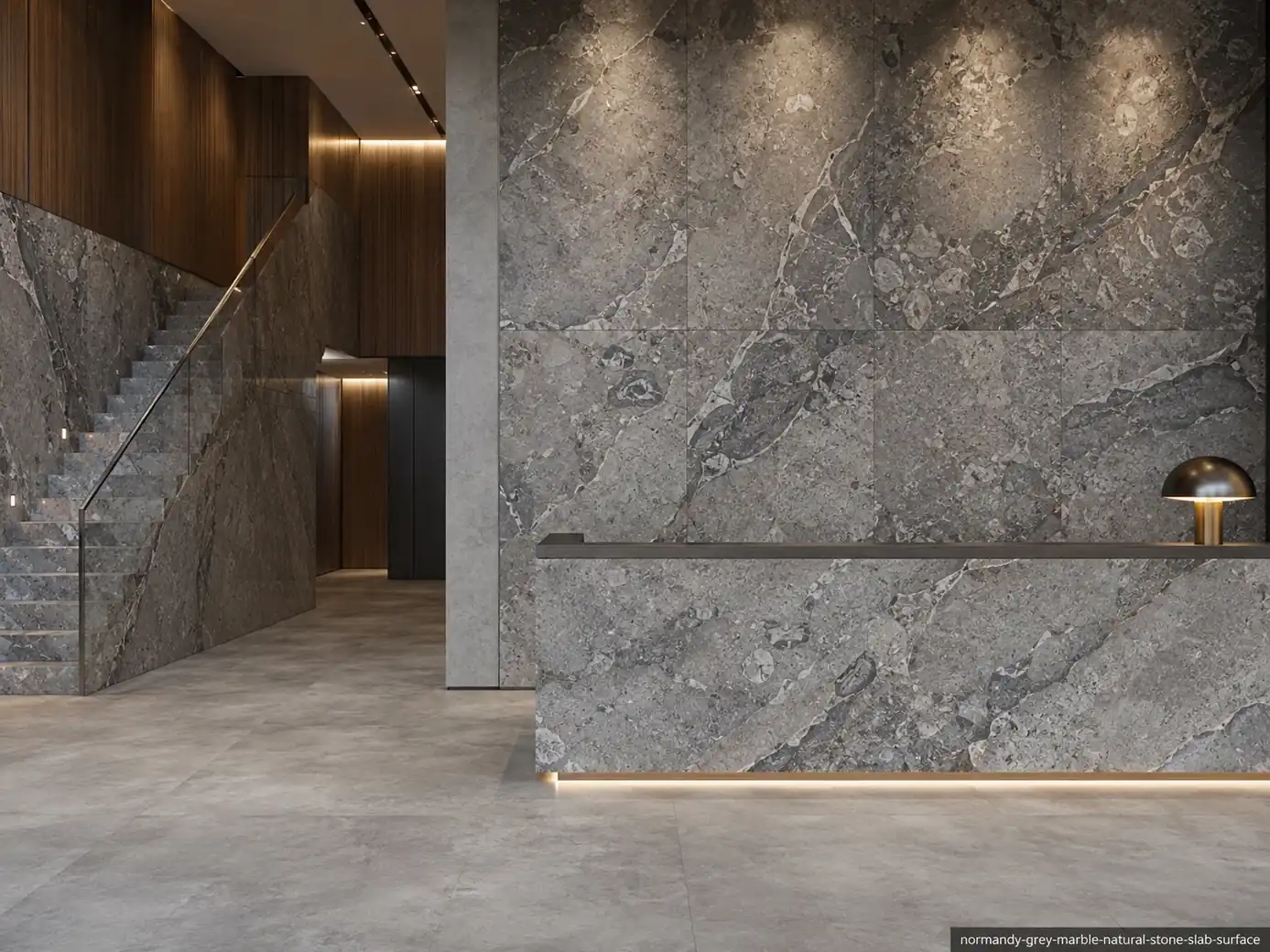 Elegant mist toned slab on lobby walls, reception counter, staircase and flooring with fossil details and charcoal channels.