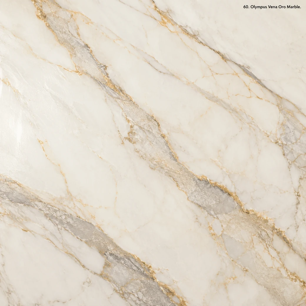 Olympus Vena Oro Marble with white stone with golden veins, champagne edges, grey centres and luminous polished stone depth.