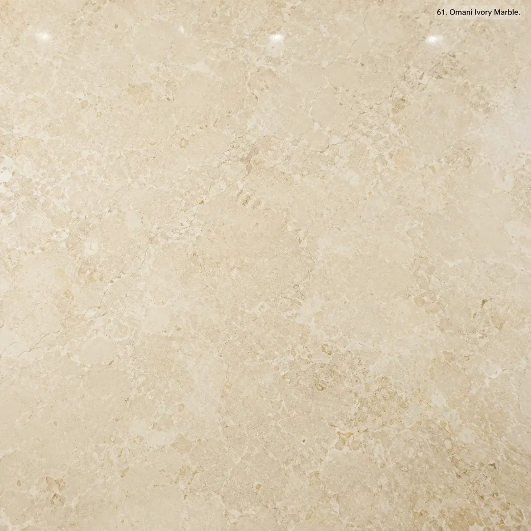 Omani Ivory Marble with warm ivory natural stone, creamy beige clouds, fossil details and a gentle polished mineral glow.