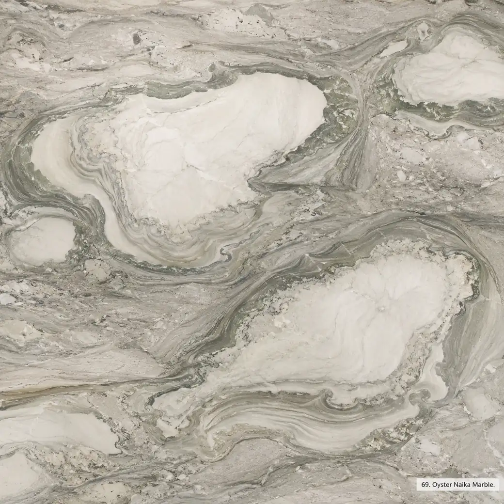 Oyster Naika Marble with pearly white grey stone, sage contours, pale islands and a soft luminous polished mineral finish.
