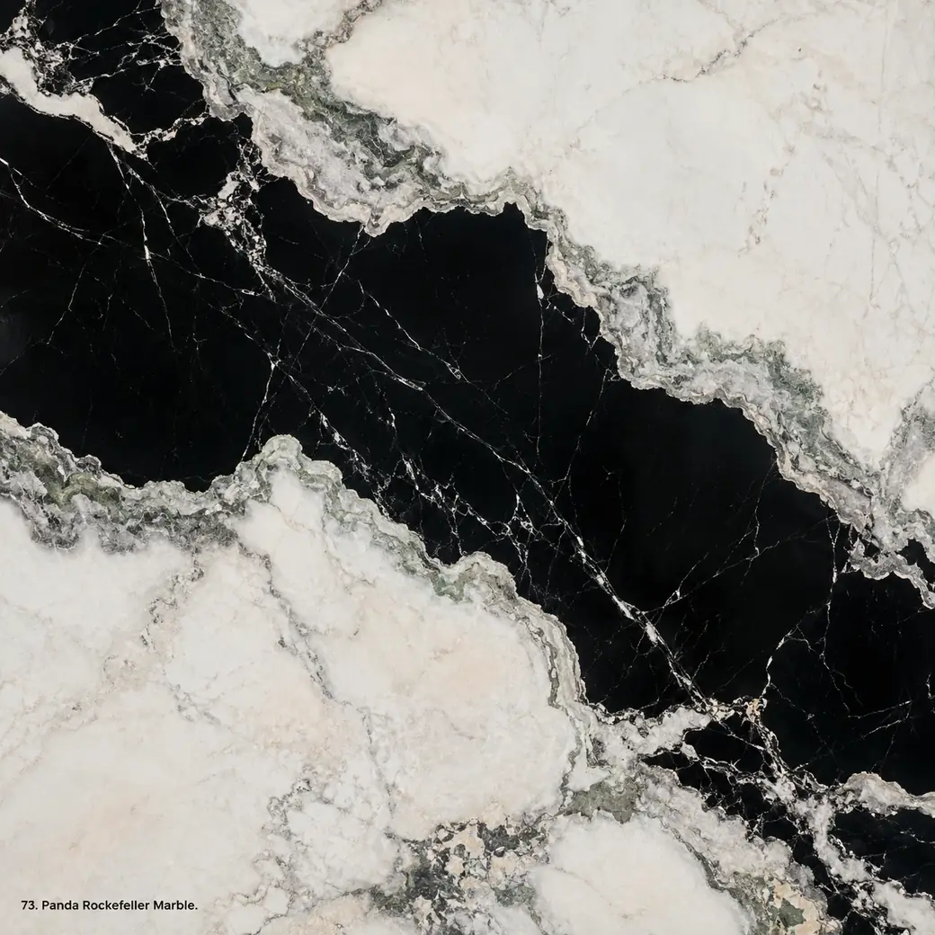 Panda Rockefeller Marble with dramatic black white stone, massive strata, silver borders and deep polished mineral depth.