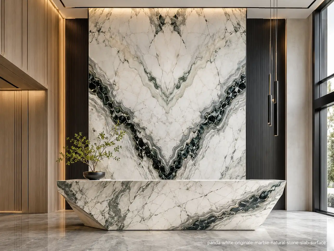 Dramatic graphic architectural slab on a lobby wall and reception desk with white, charcoal and green-grey mineral bands.