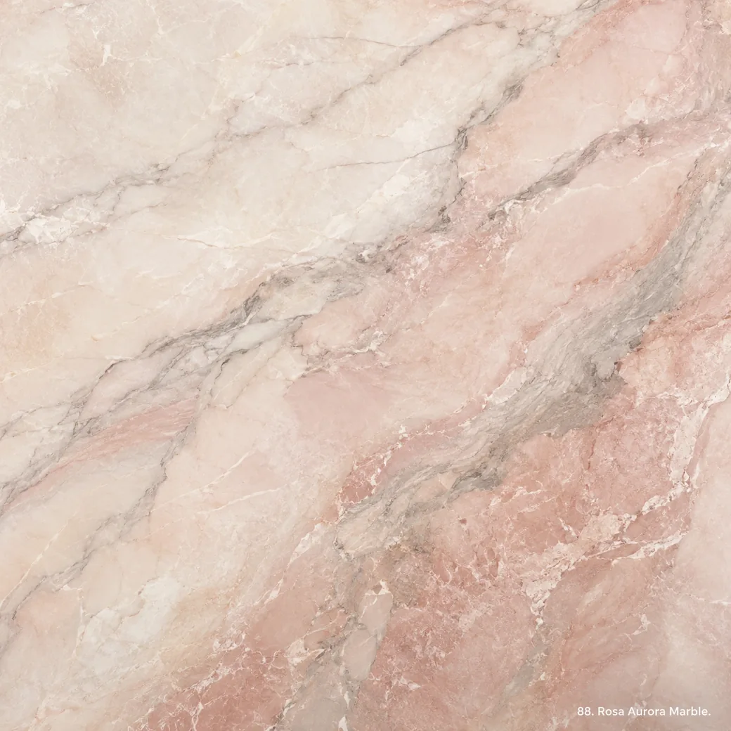 Rosa Aurora Marble with soft blush Portuguese stone, cream ribbons, grey wisps and a gentle pearlescent polished finish.