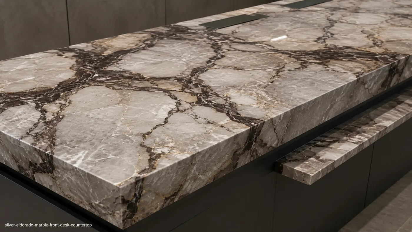 Silver Eldorado Marble front desk top with silver crystalline islands and dark charcoal-brown channels.