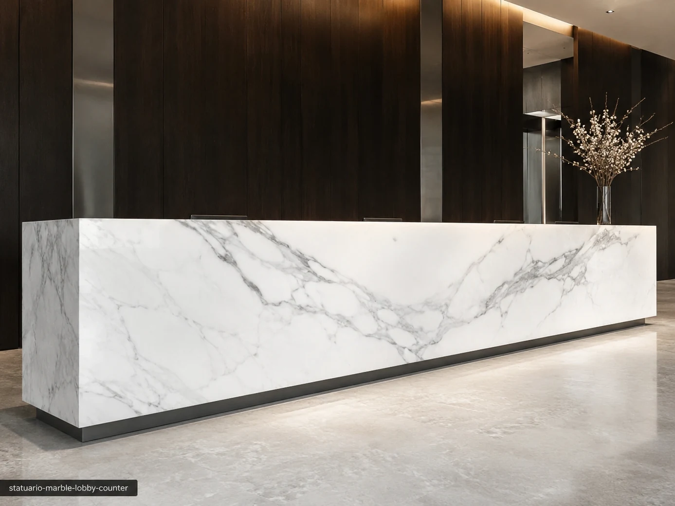 Statuario Marble lobby counter with crystalline white stone and a monumental flowing grey vein across the front.
