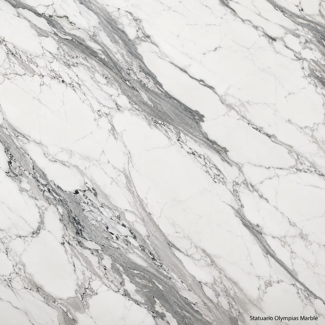 Statuario Olympias Marble with luminous Greek white stone, graphite ribbons, silver clusters and a crisp polished finish.