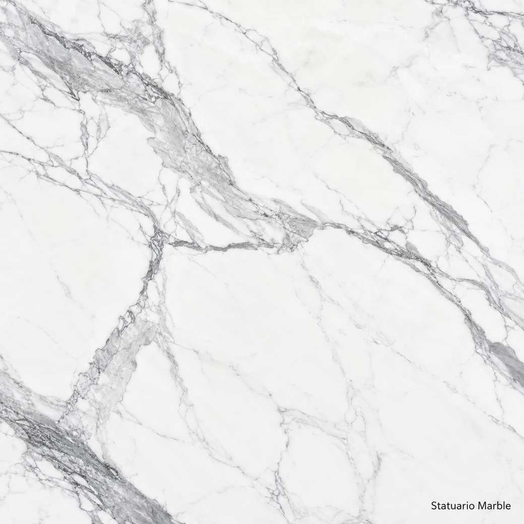 Statuario Marble with brilliant white sculptural stone, broad grey ribbons, pencil veins and a luminous polished finish.