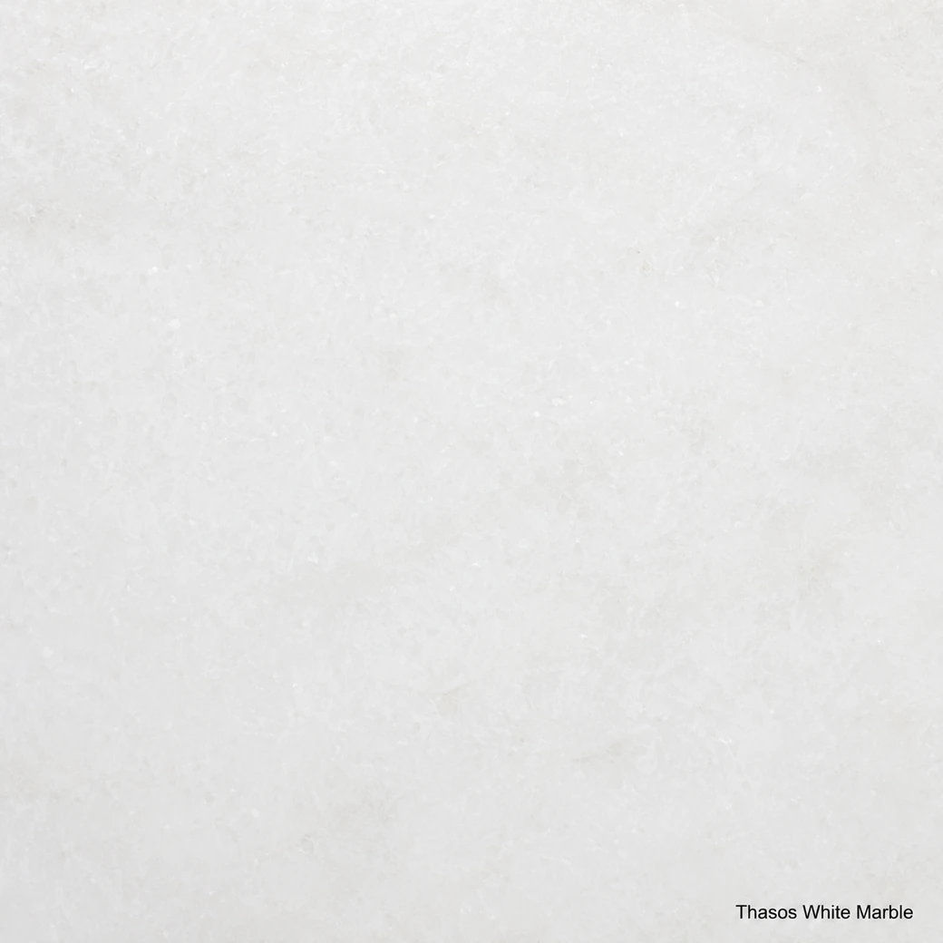 Thasos White Marble with brilliant snow white stone, fine calcite crystals, faint grey shadows and an icy polished finish.