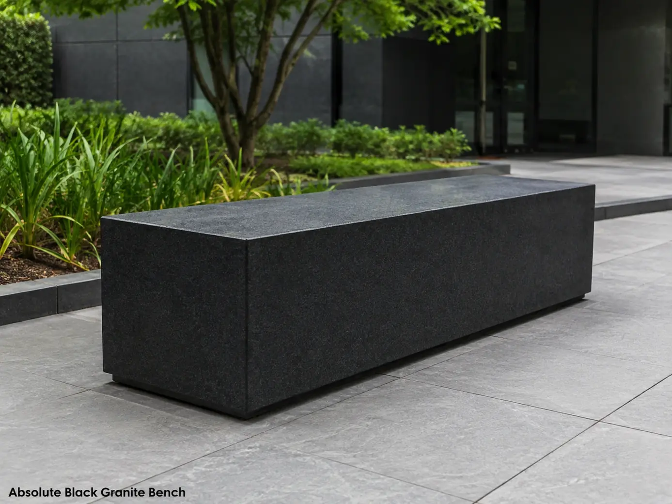 Leathered Absolute Black granite bench with velvet-black finish installed in a contemporary public space