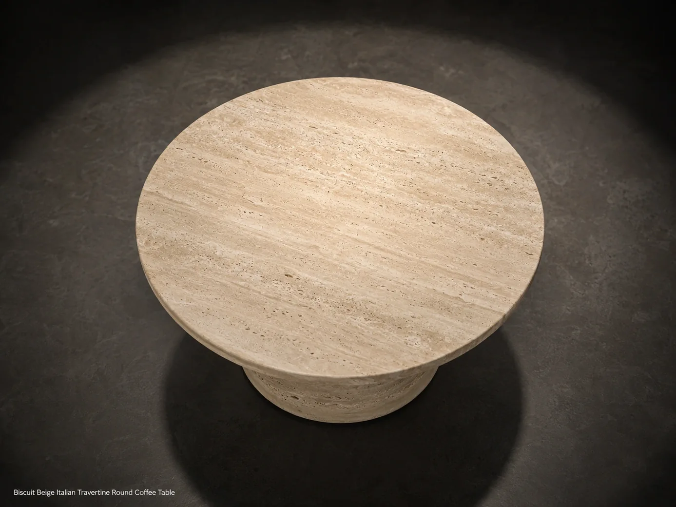 Biscuit beige travertine coffee table viewed from above on a charcoal microcement gallery floor