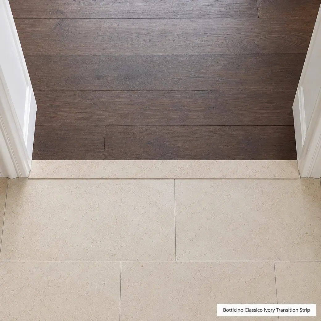 Overhead Botticino Classico threshold between oak and limestone floors with brushed beige-ivory finish.