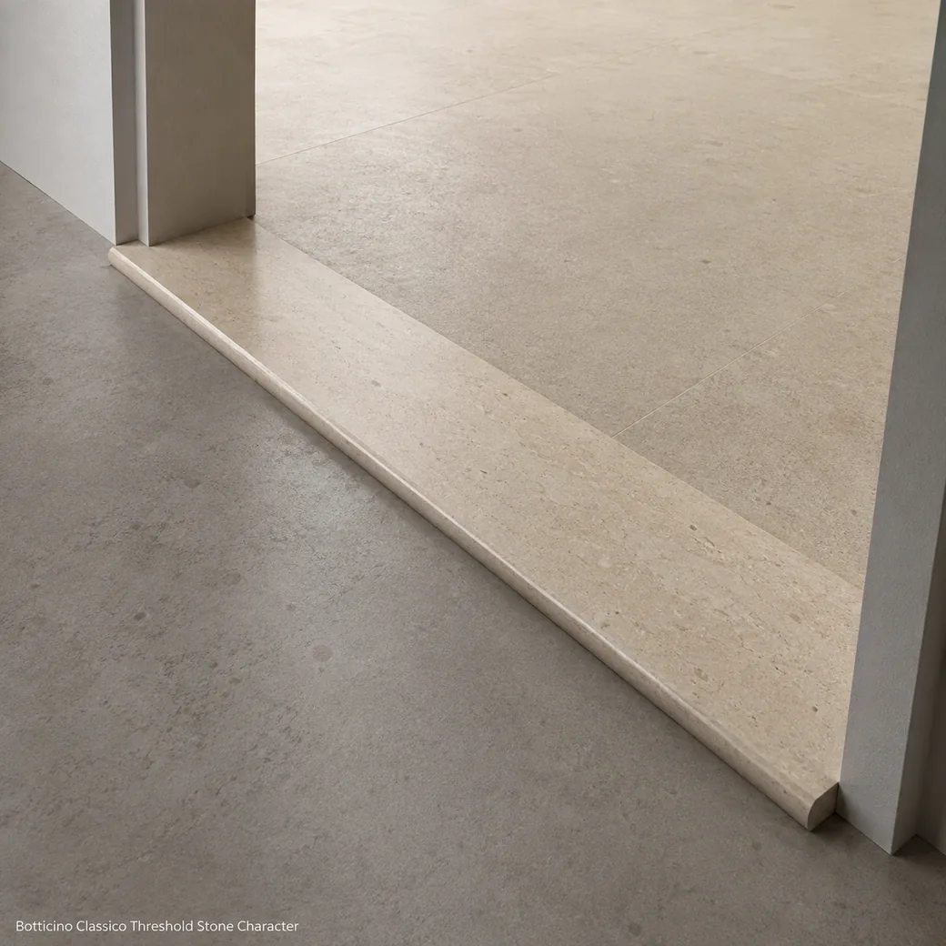 Brushed Botticino Classico threshold with warm beige-ivory limestone and fine brown mineral movement