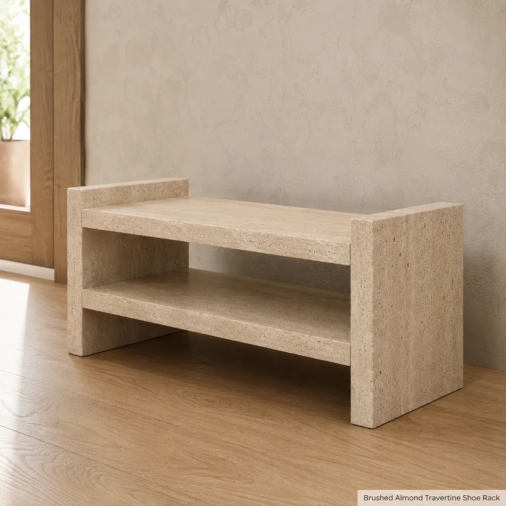 Almond beige travertine shoe rack in oak entry hall, low side view showing empty shelves, brushed pores and thick edges.