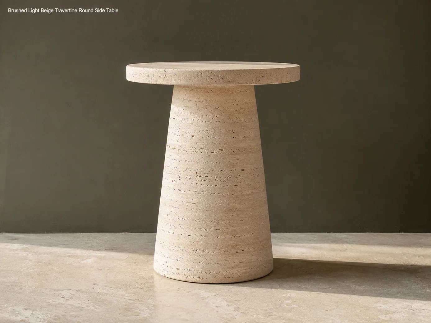 Light beige travertine side table shown in side profile against an olive-grey gallery wall
