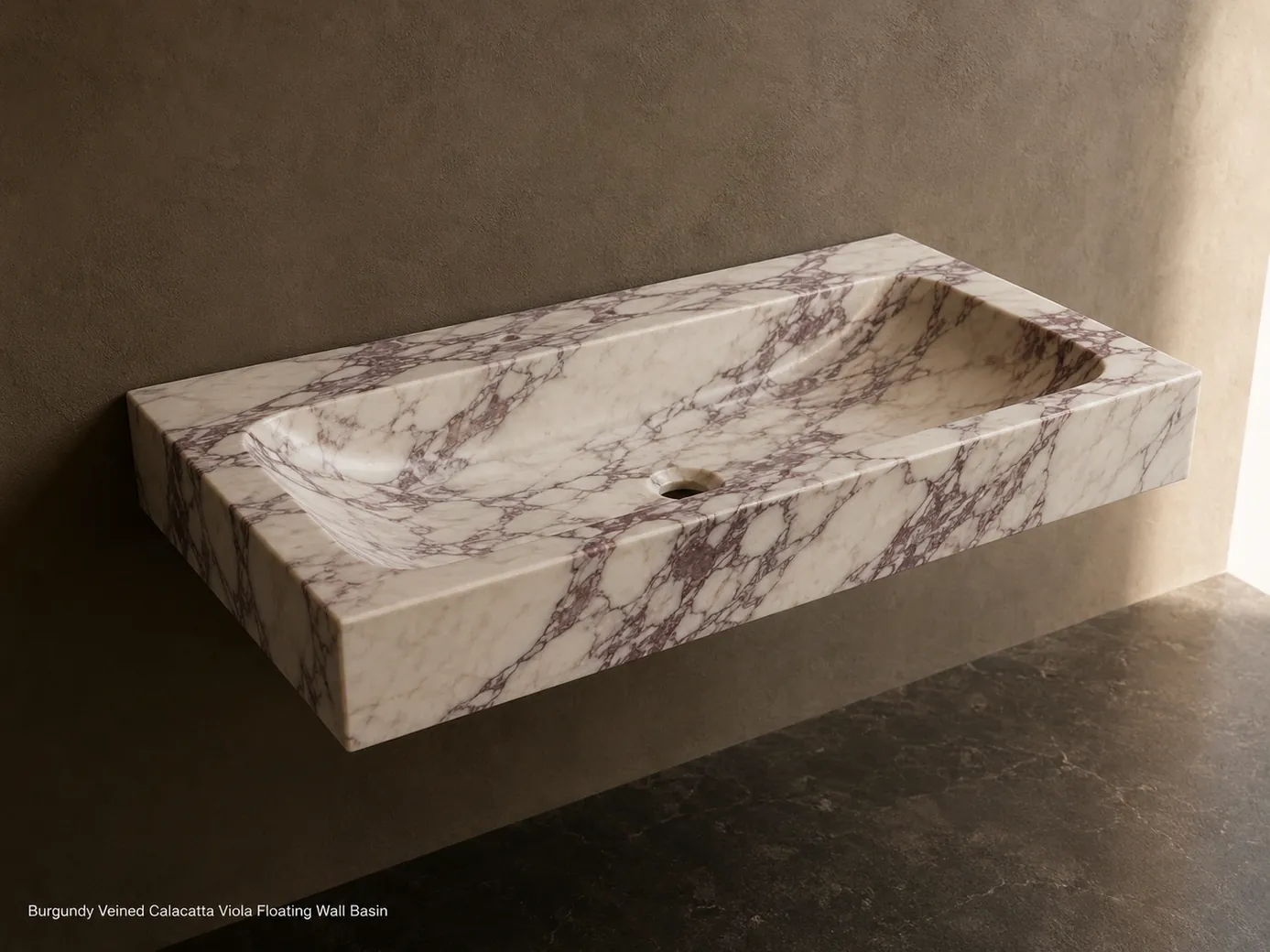 Floating Calacatta Viola basin on taupe wall, viewed from above with burgundy veining and concealed support.