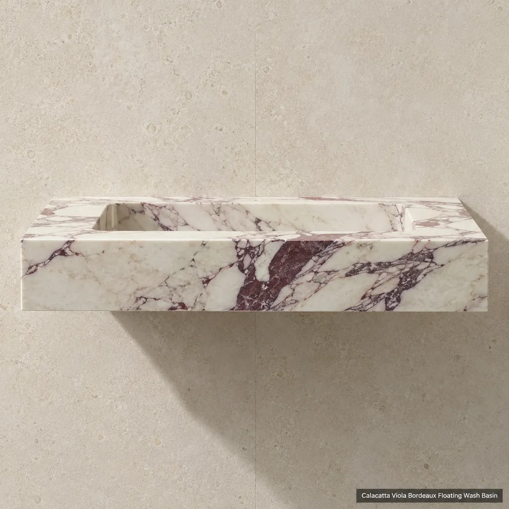 Side-profile floating Calacatta Viola wall basin with burgundy movement and clean concealed support