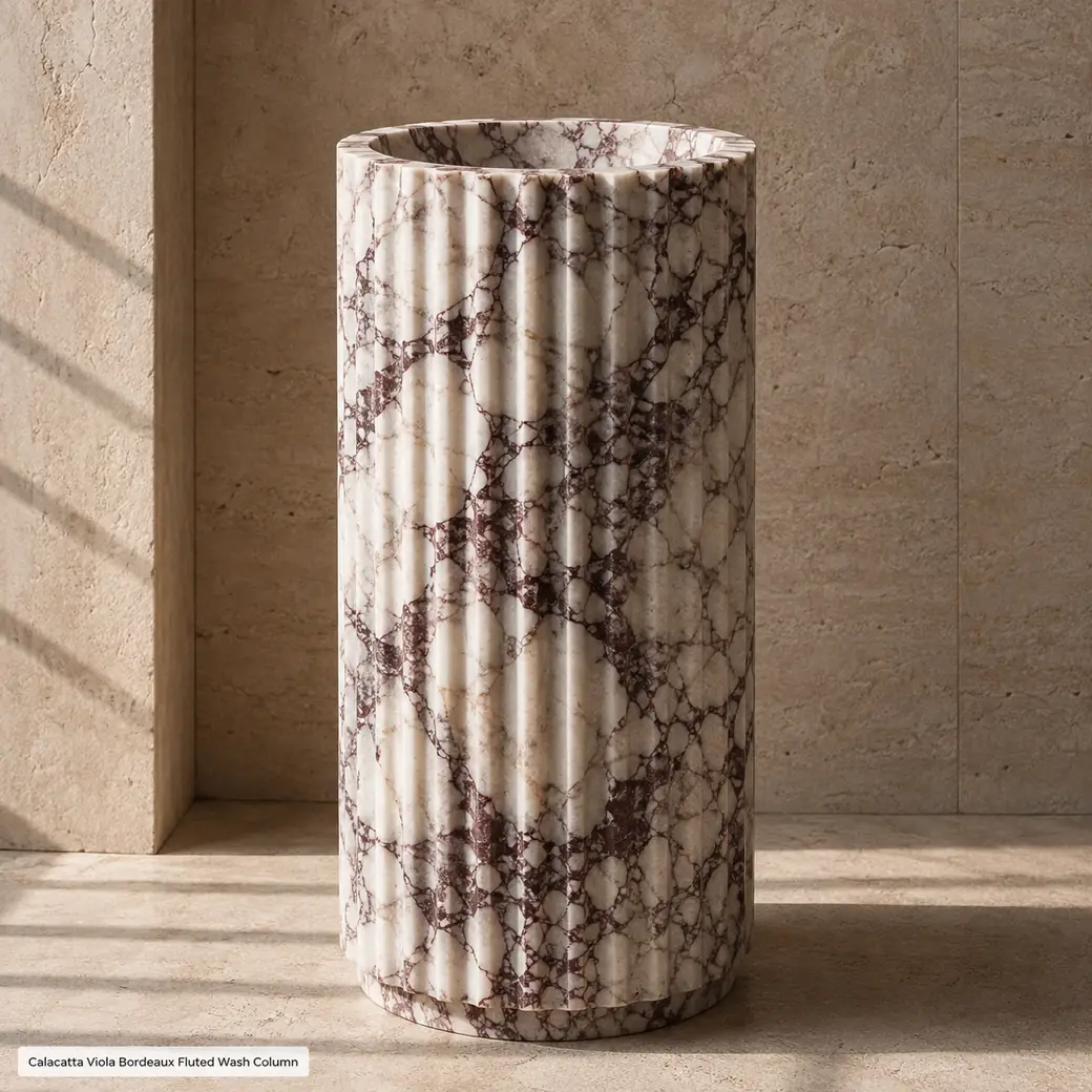 Side-profile Calacatta Viola fluted basin with burgundy veins and rhythmic matte vertical grooves