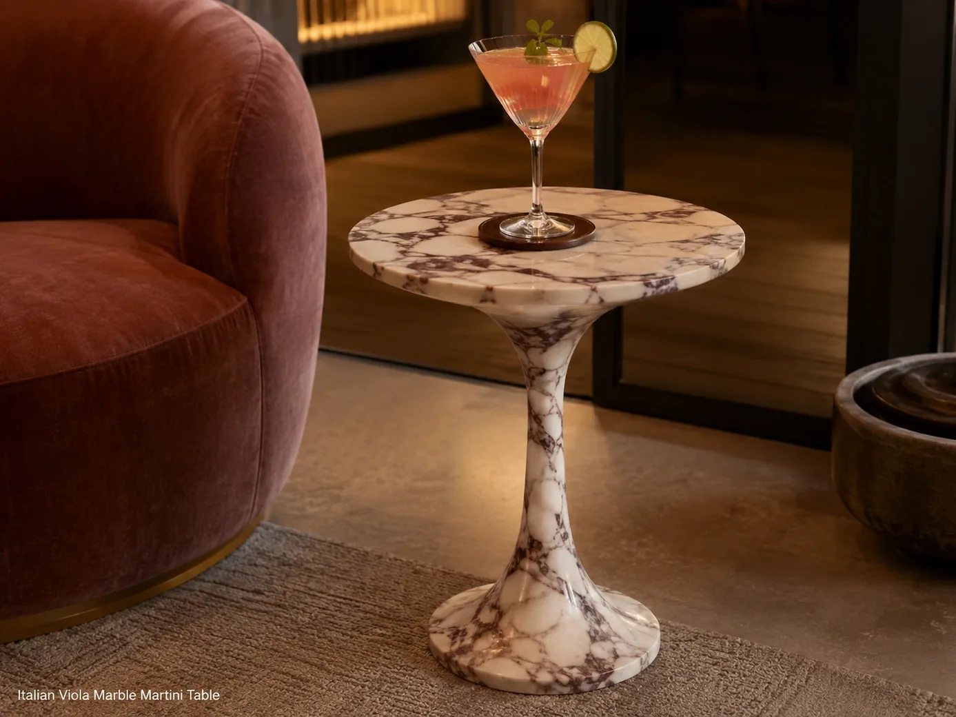 Polished Calacatta Viola martini table with burgundy-purple veins beside lounge seating and cocktail glass