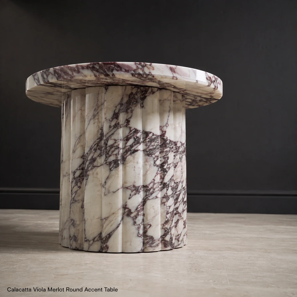 Low-angle Calacatta Viola accent table with wine-red veins and polished architectural pedestal